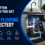 Licensed plumber inspecting hot water system